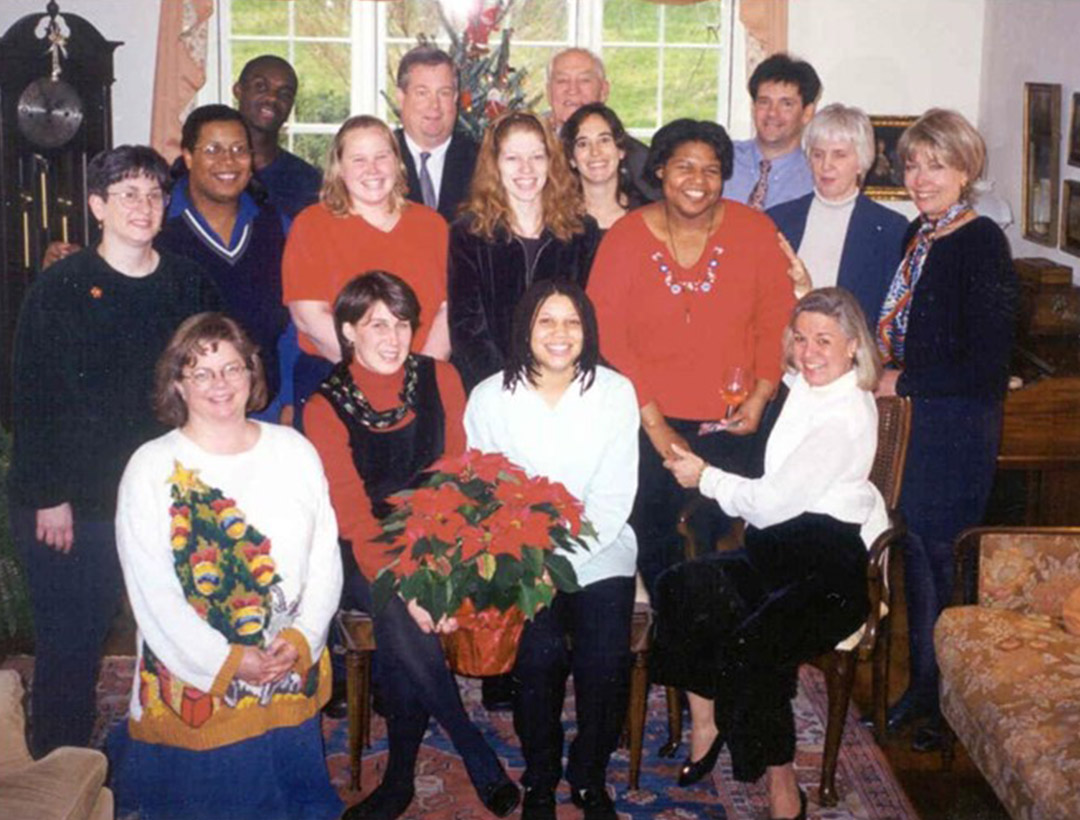 A group photo including Susan Hawfield and Patty R. Johnson at a Christmas party