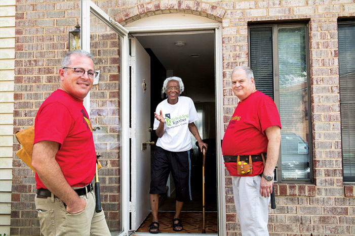 Jason Sheer (left) and David Baum helped make improvements on Eula Knight’s home as volunteers with Rebuilding Together Montgomery County.