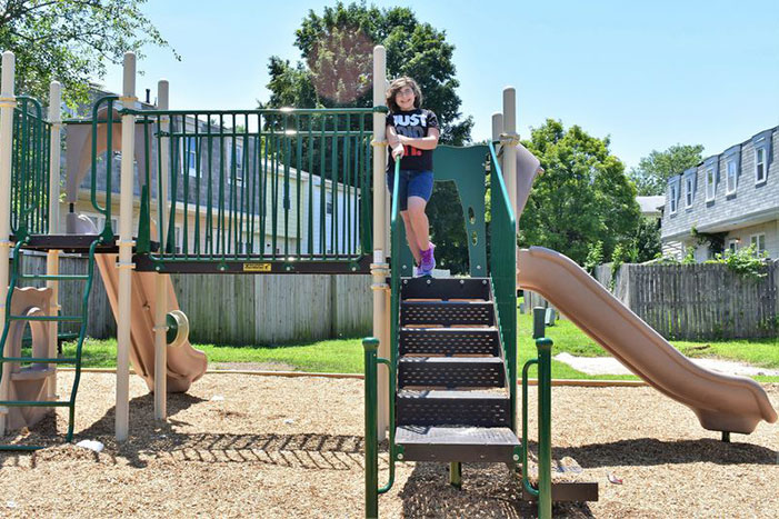 Middle schooler, Keira Ugaz, takes time out from “exercising” to pose on the newly installed community playground located on Still Meadows Drive in Severn on July 15, 2019.