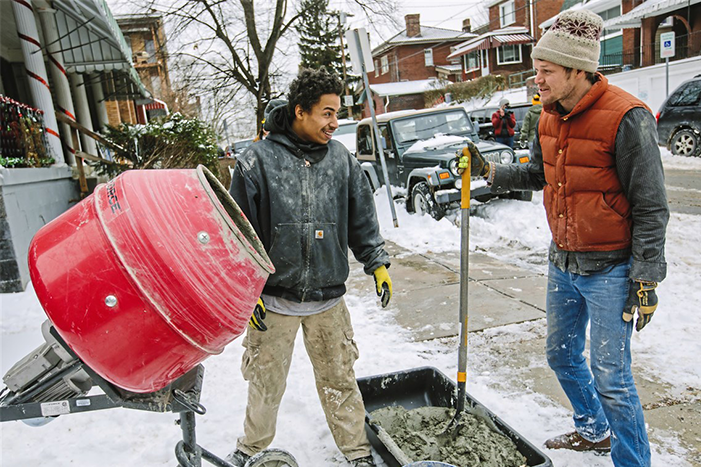 Mixing concrete on project site with AmeriCorps members and Rebuilding Together